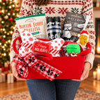 Winter Walks holiday dog gift basket held in someone's hands