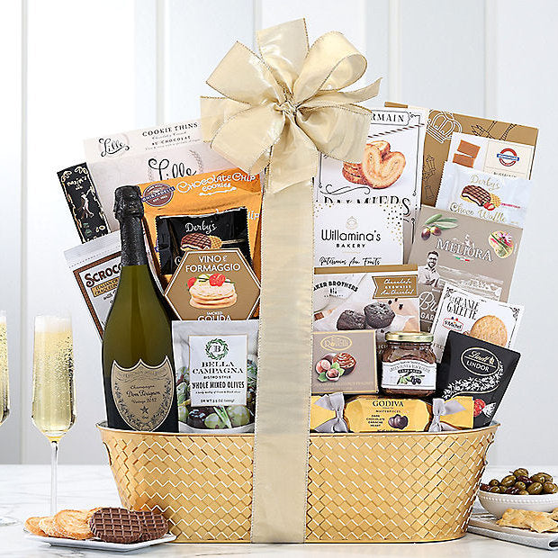 Gift basket with champagne, snacks, and a bow on a white background